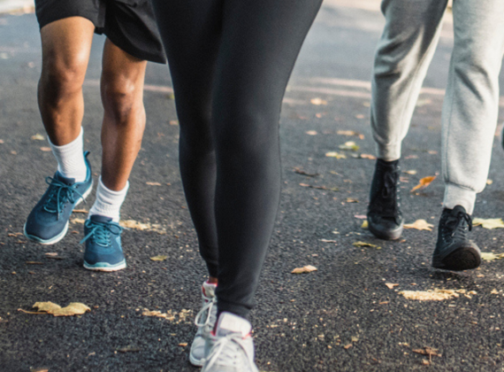 Lower half of three people in run-wear