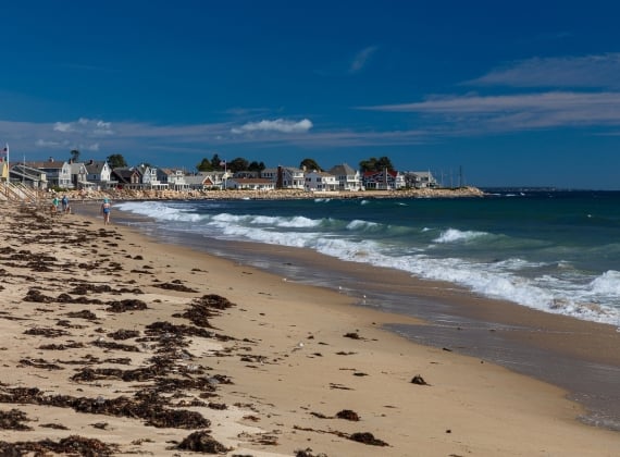 Beach, Ocean Surf and Waterfront Houses, Wells, Maine, USA. - stock photo