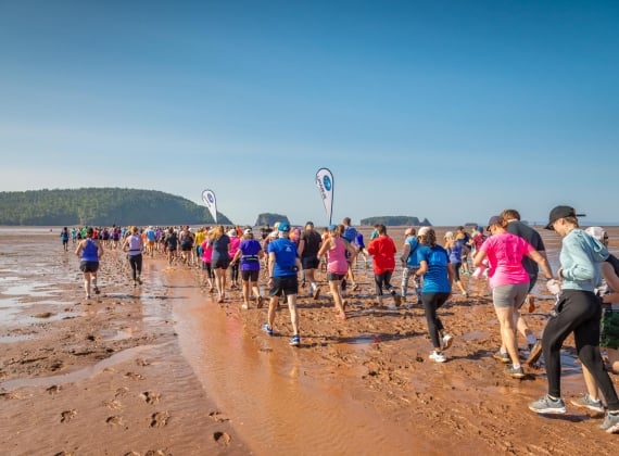 Not Since Moses Run participants running on the beach