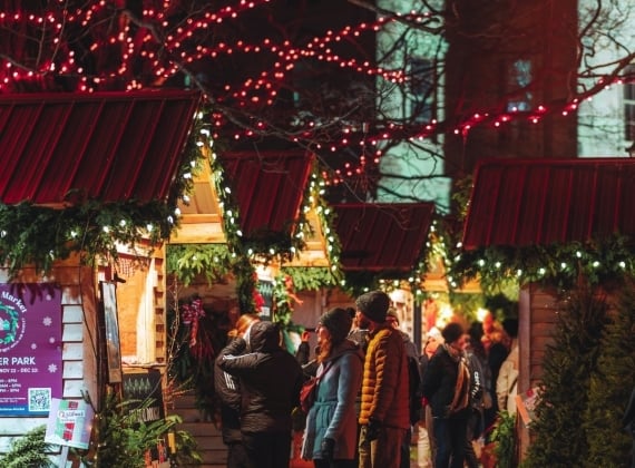 People at the Mistletoe Market stalls 