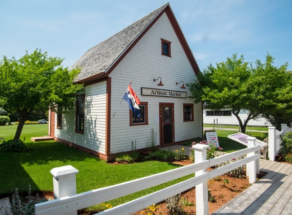 White Building with Artisan Market Sign