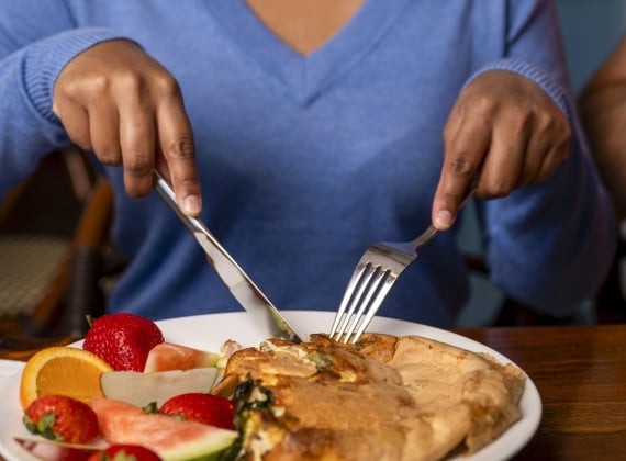 person-enjoying-breakfast-at-js-amazing-breakfast