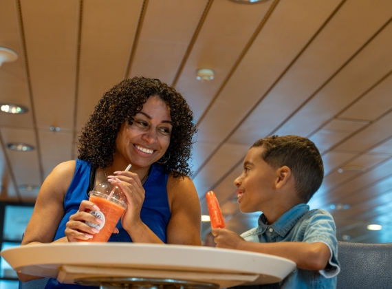 Mom and son enjoying smoothies