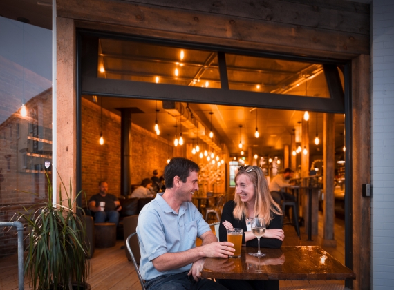 A couple enjoys some drinks at Sip Café