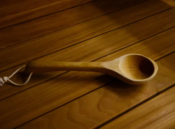 A handmade wooden spa ladle.