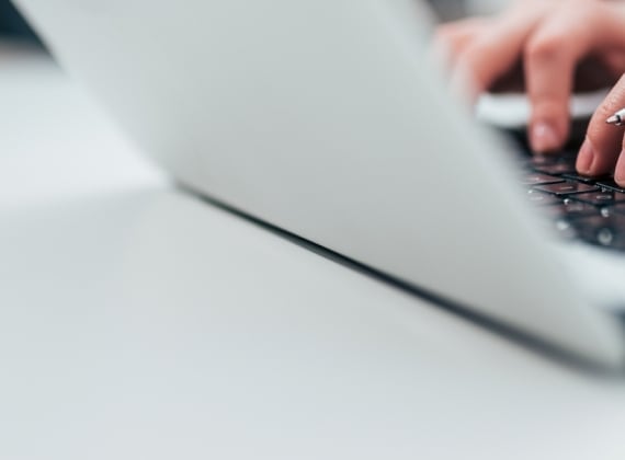 Typing on laptop
