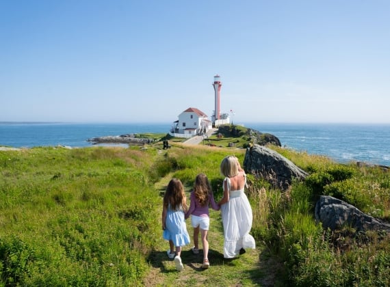 Mother and Daughters Walking Towards Cape Forchu