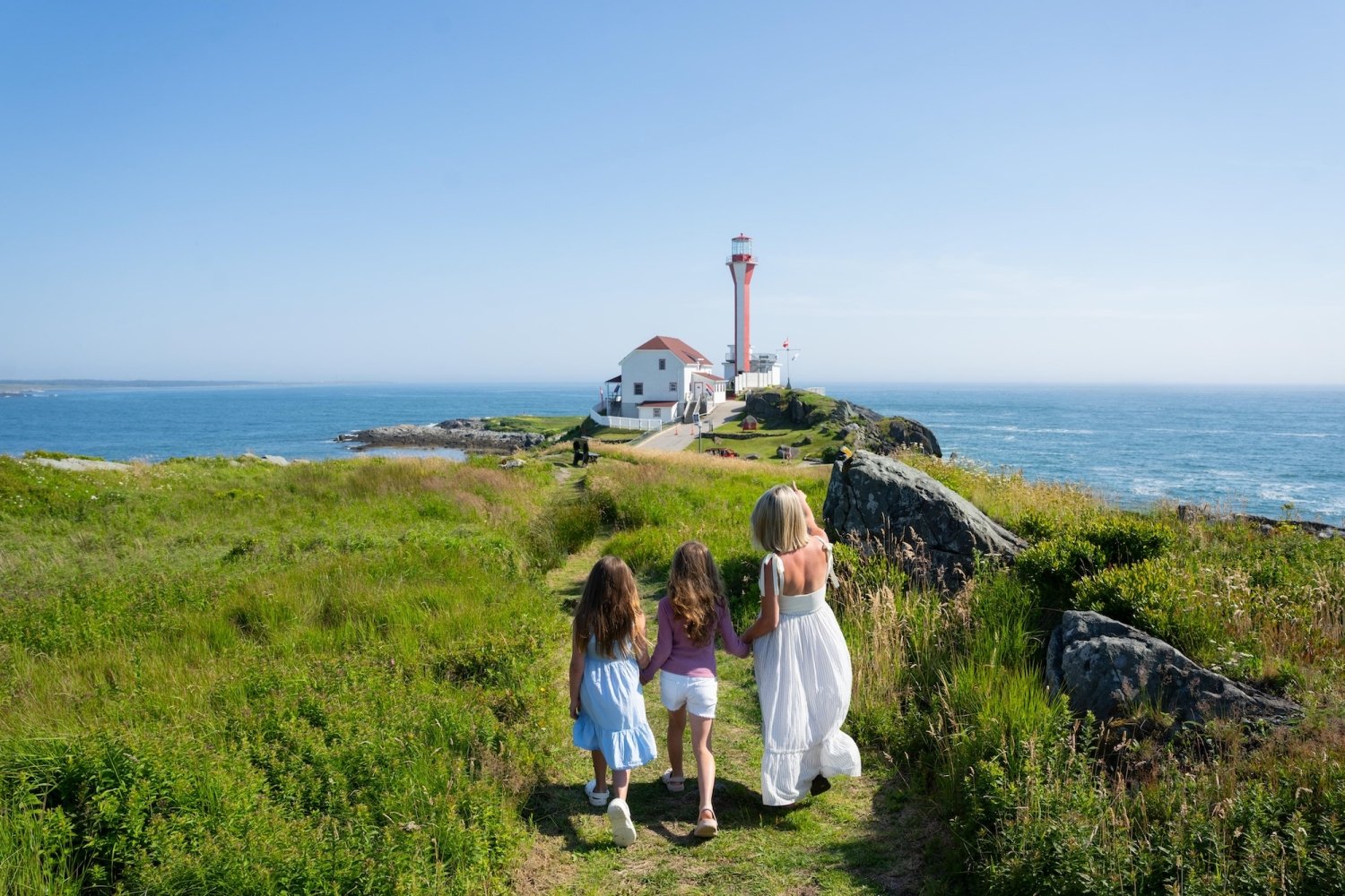 Mother and Daughters Walking Towards Cape Forchu